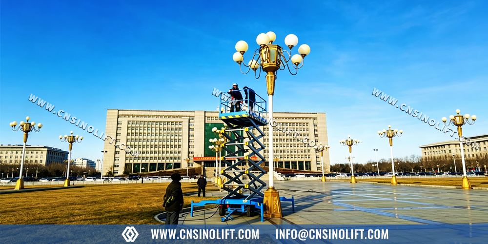 Towable mobile scissor lift used for city street lamp maintenance